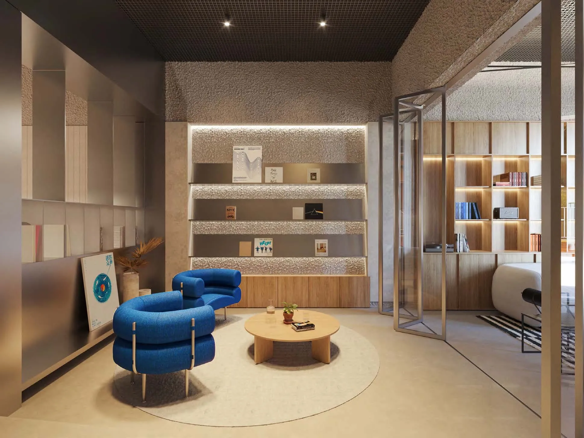 Visualización de la zona de estar con biblioteca y butacas azules